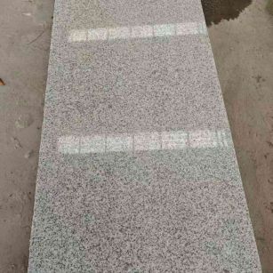 通化芝麻白光面毛板